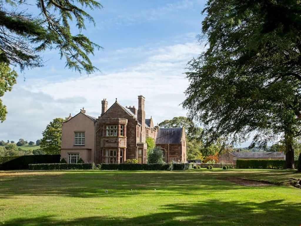 The garden front of Chorlton Hall, across the lawn